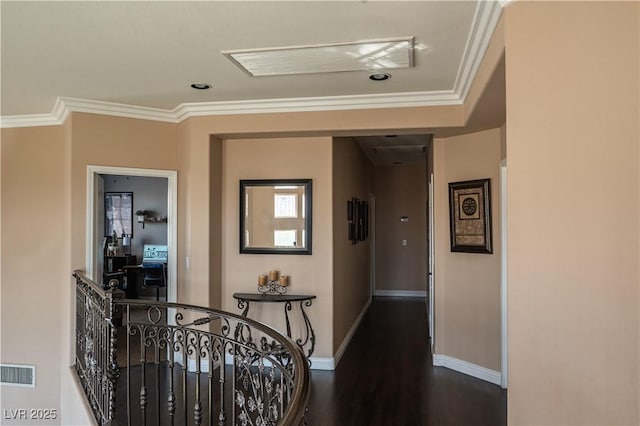 corridor with ornamental molding and dark hardwood / wood-style floors