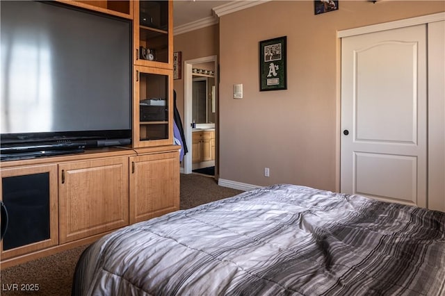 bedroom with crown molding, carpet floors, and a closet