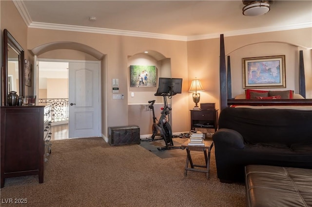 bedroom with crown molding and carpet