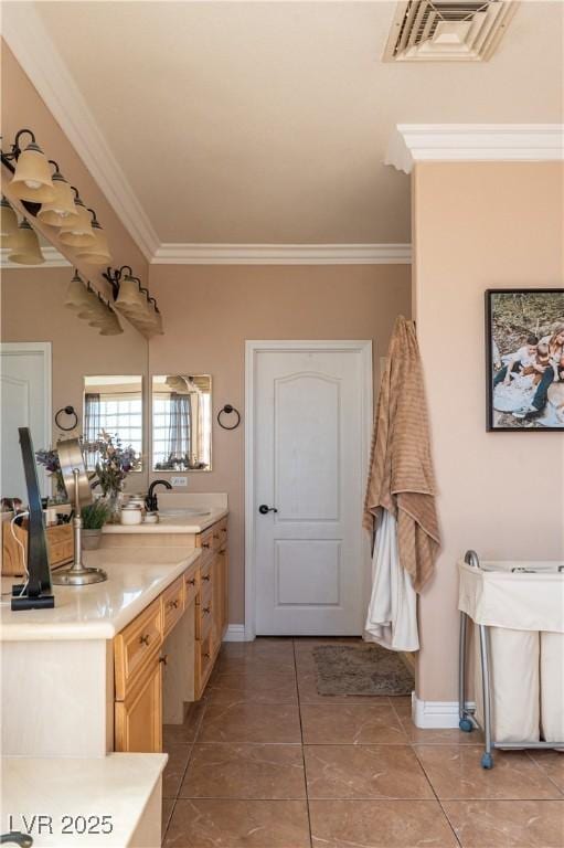 bathroom with vanity, crown molding, and tile patterned floors