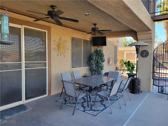 view of patio featuring ceiling fan