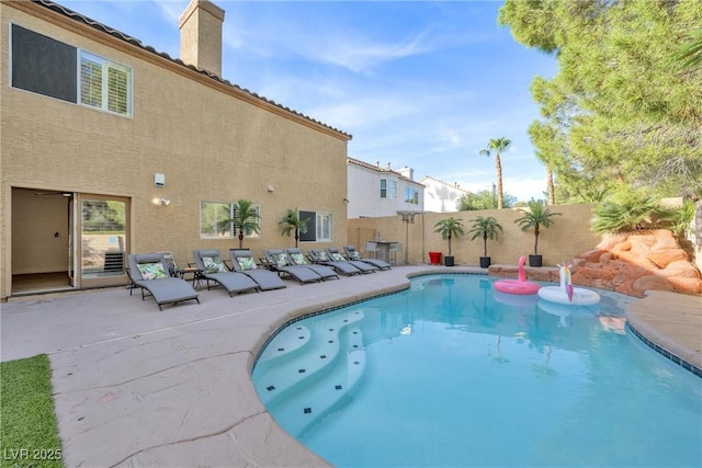 view of pool with a patio area