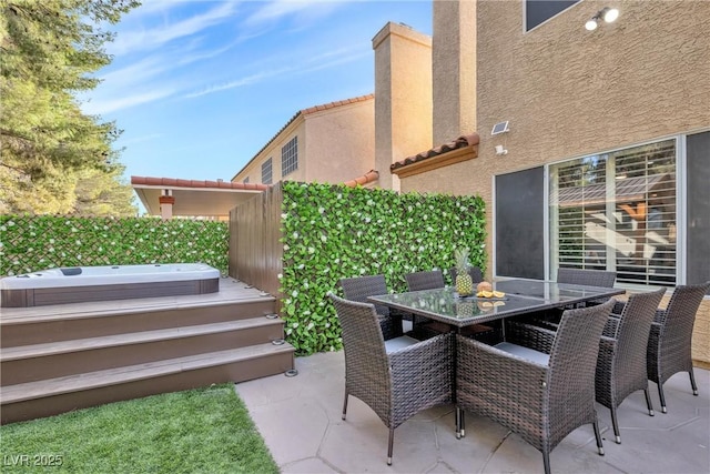 view of patio / terrace featuring a jacuzzi