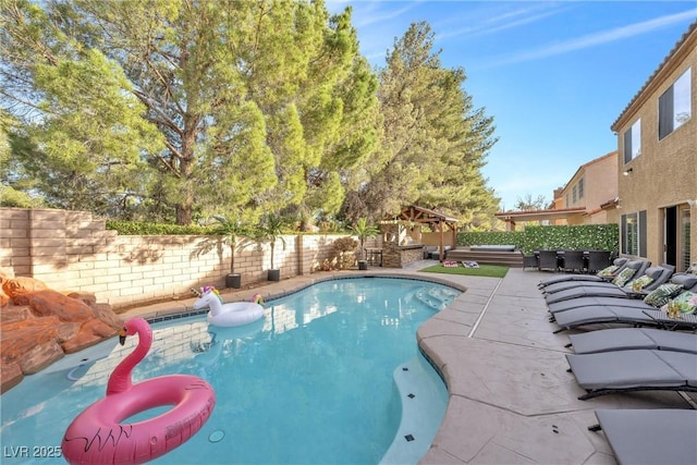 view of swimming pool with a patio and a gazebo