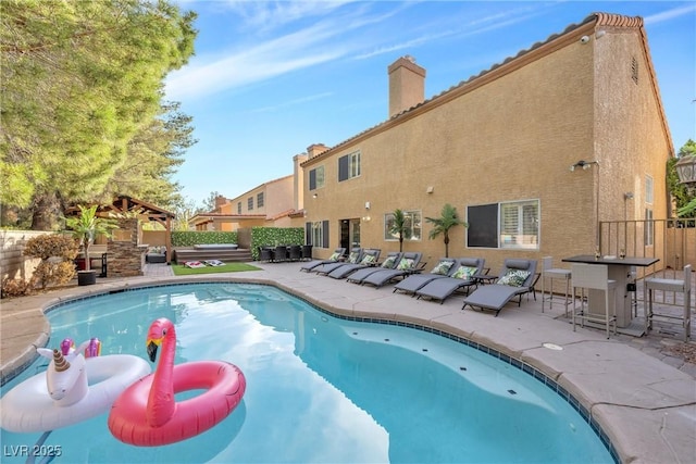 view of pool featuring a patio