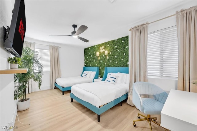 bedroom with hardwood / wood-style flooring and ceiling fan