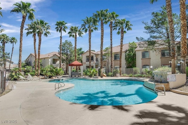 view of swimming pool with a patio area