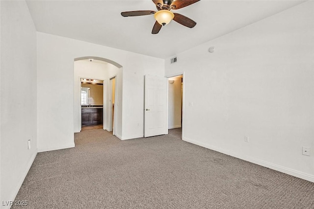 spare room featuring carpet flooring and ceiling fan