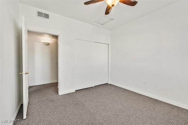 spare room with ceiling fan and carpet flooring