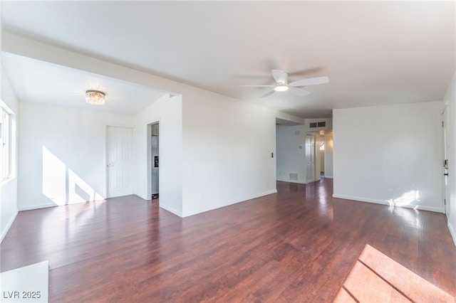 spare room with dark hardwood / wood-style floors and ceiling fan