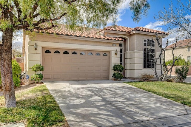 mediterranean / spanish-style home with stucco siding, concrete driveway, an attached garage, and a tiled roof