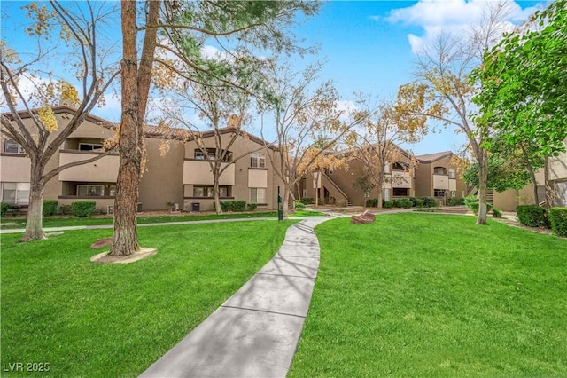 view of community featuring a lawn