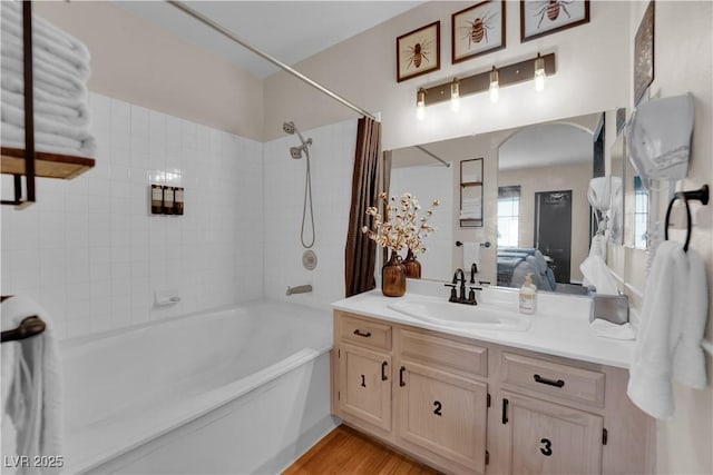 bathroom featuring vanity, hardwood / wood-style floors, and shower / tub combo with curtain