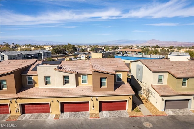 bird's eye view featuring a residential view and a mountain view