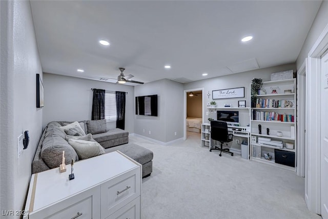 carpeted living room featuring ceiling fan