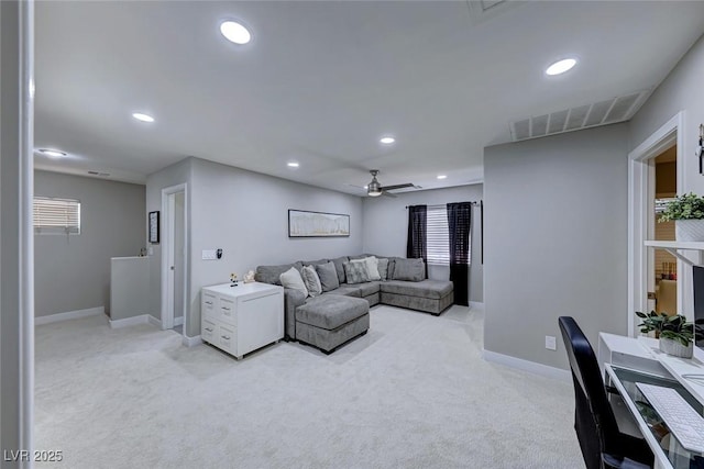 living room with light colored carpet and ceiling fan