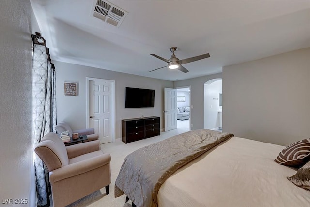 bedroom featuring light colored carpet and ceiling fan