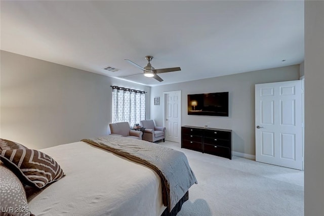 bedroom with light carpet and ceiling fan