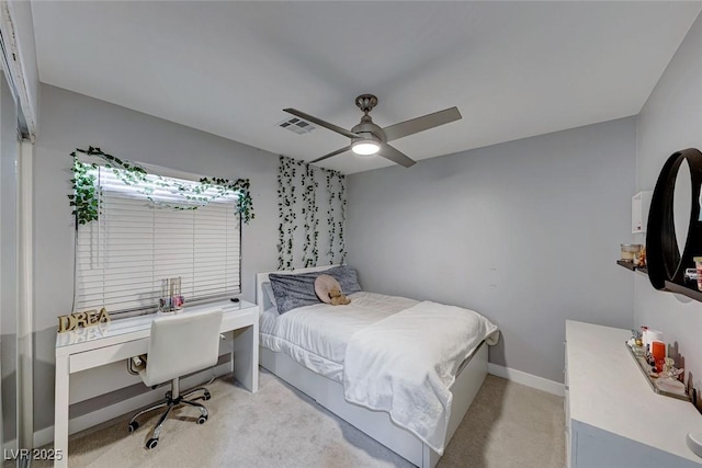 bedroom featuring light colored carpet and ceiling fan