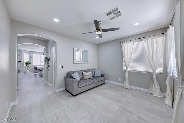 living area featuring ceiling fan