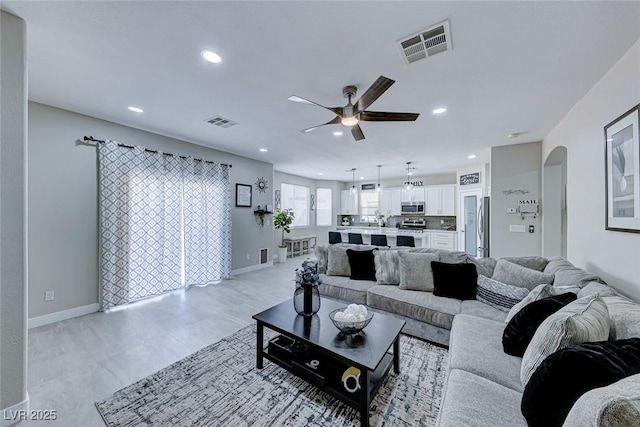 living room featuring ceiling fan