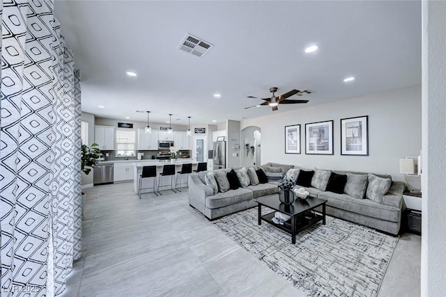 living room with ceiling fan