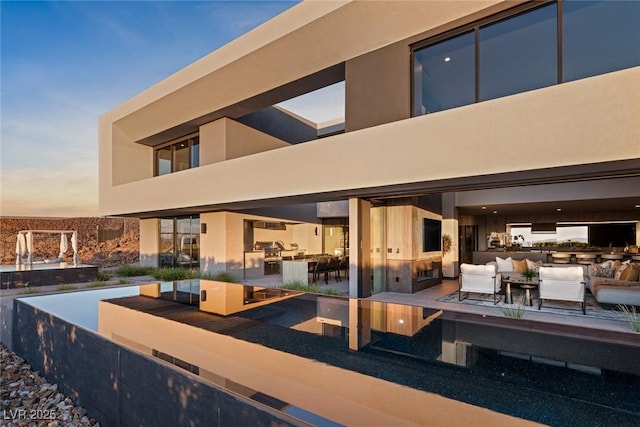 patio terrace at dusk with outdoor lounge area