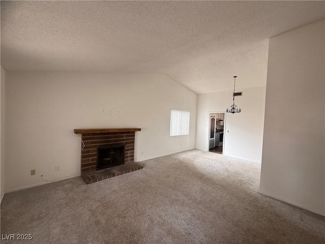 unfurnished living room featuring lofted ceiling, a fireplace, carpet floors, and a textured ceiling