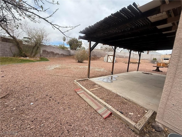 view of yard featuring a patio area and a fenced backyard