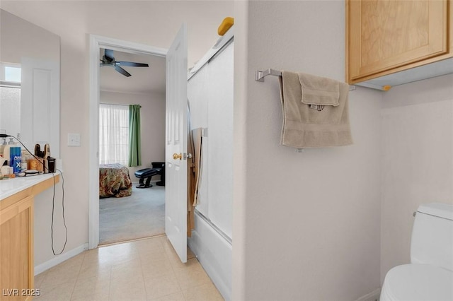 full bathroom featuring vanity, ceiling fan, shower / bath combination with glass door, and toilet