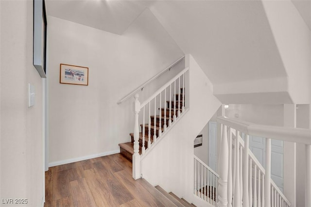 stairway featuring hardwood / wood-style floors