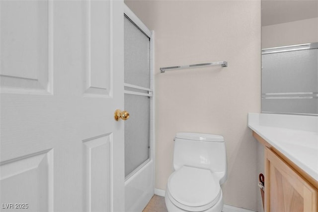 full bathroom with tile patterned floors, vanity, toilet, and combined bath / shower with glass door