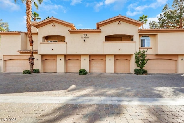 view of front of house with a balcony and a garage