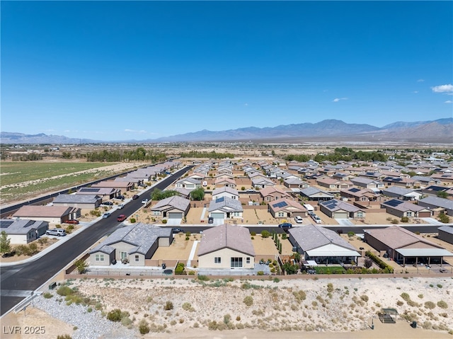 drone / aerial view with a residential view and a mountain view