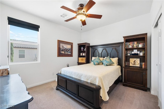 bedroom with visible vents, ceiling fan, light carpet, and baseboards