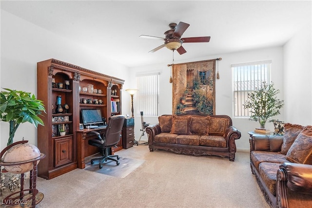 carpeted office with ceiling fan