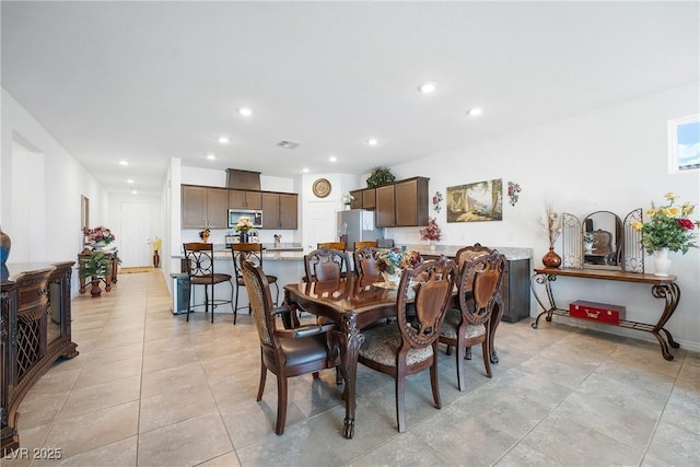 dining space featuring light tile patterned floors, visible vents, and recessed lighting