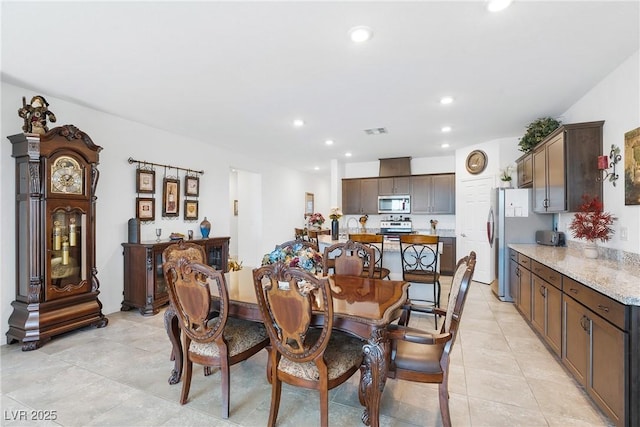 dining space with recessed lighting, visible vents, and light tile patterned flooring