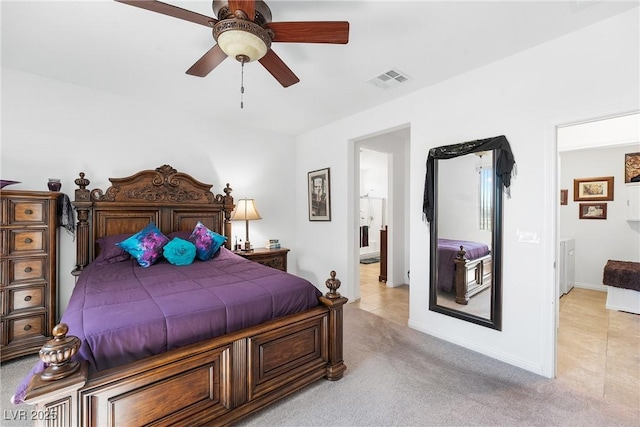 bedroom with baseboards, ceiling fan, visible vents, and light colored carpet