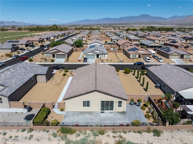 bird's eye view featuring a residential view and a mountain view