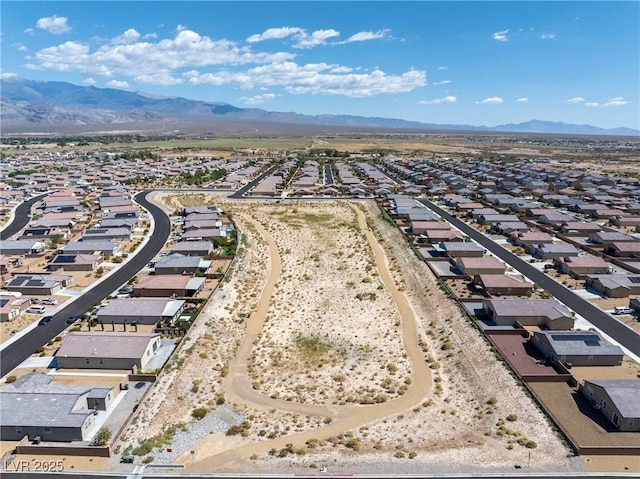 drone / aerial view with a residential view and a mountain view