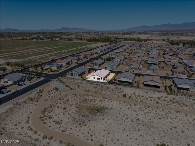 bird's eye view with a residential view and a mountain view