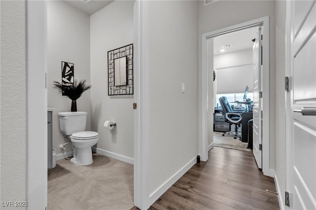 4267 E Highvale Ct, Pahrump, NV 89061 - corridor featuring baseboards, visible vents, and wood finished floors