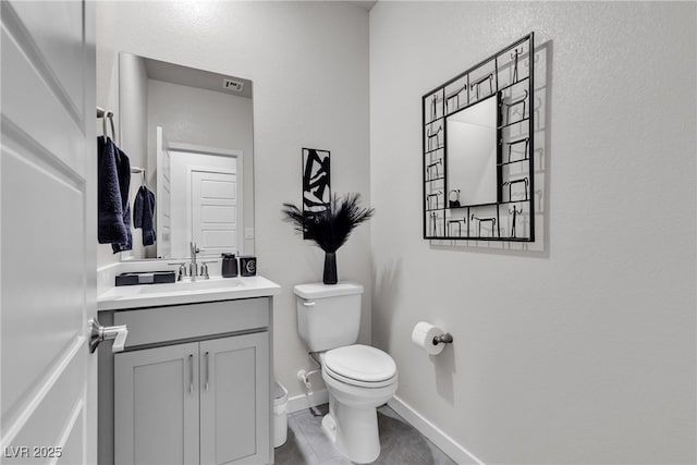 4267 E Highvale Ct, Pahrump, NV 89061 - half bath featuring baseboards, toilet, tile patterned flooring, and vanity