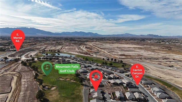 birds eye view of property with a mountain view