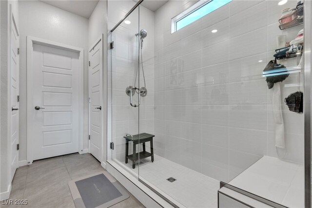 bathroom featuring walk in shower and tile patterned floors