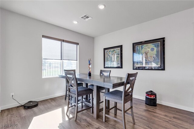 dining room with hardwood / wood-style floors