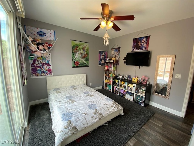 bedroom featuring dark wood-type flooring and ceiling fan