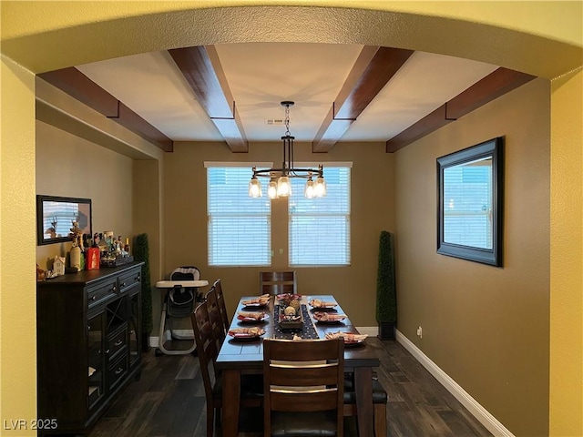 dining area featuring beamed ceiling, plenty of natural light, and dark hardwood / wood-style flooring