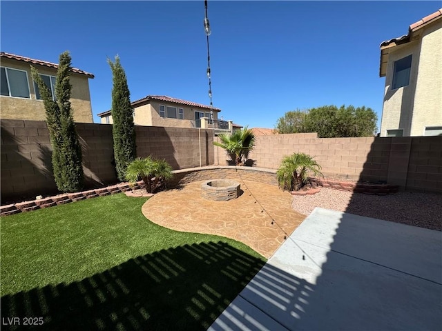 view of yard with a patio and an outdoor fire pit